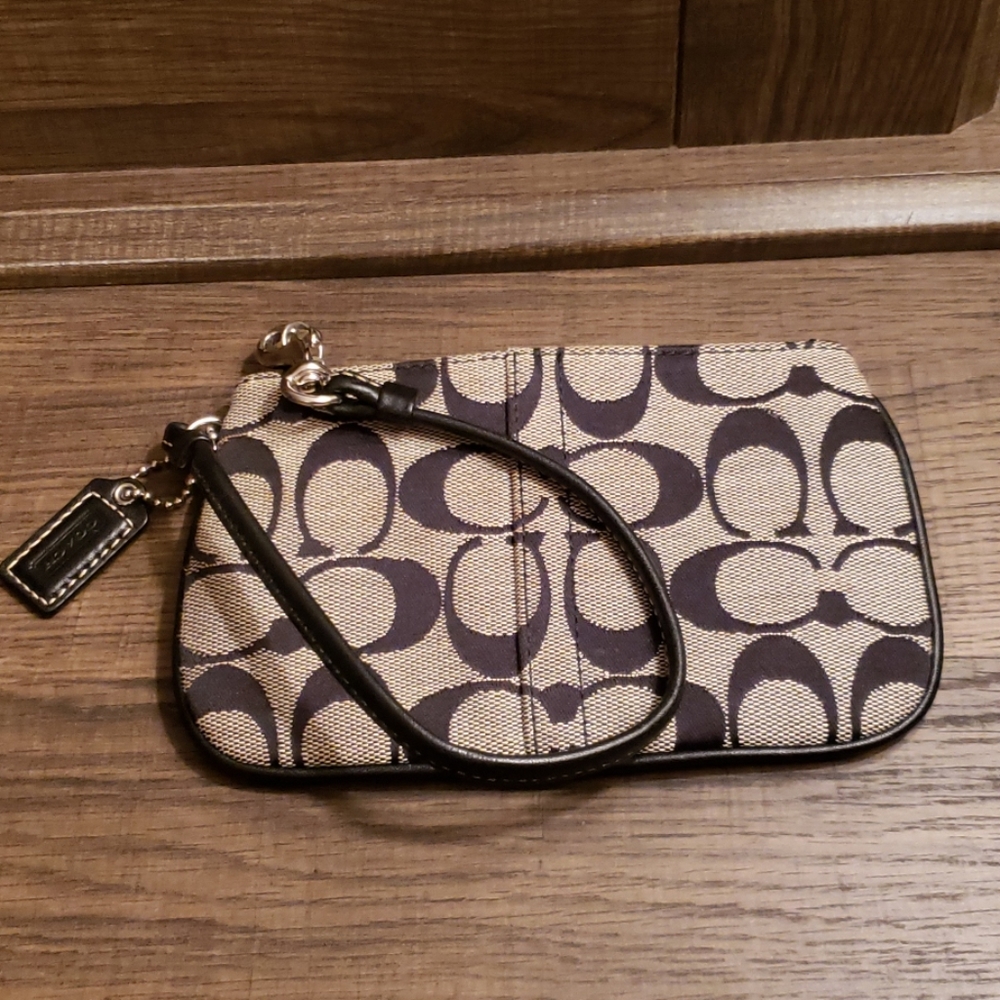 Gray and black Coach wristlet